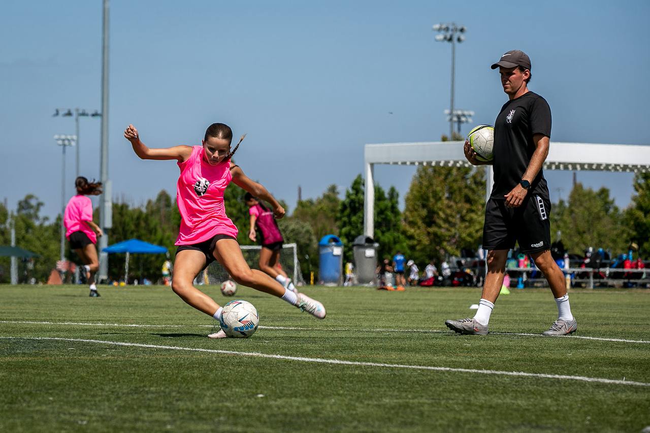 Julian Svoboda coaching a player with the ball